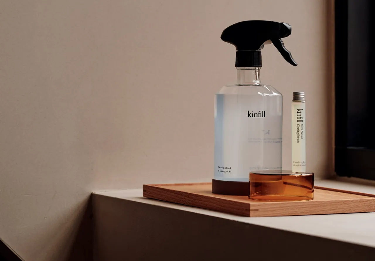 Kinfill packaging design set in low light in a prestige setting