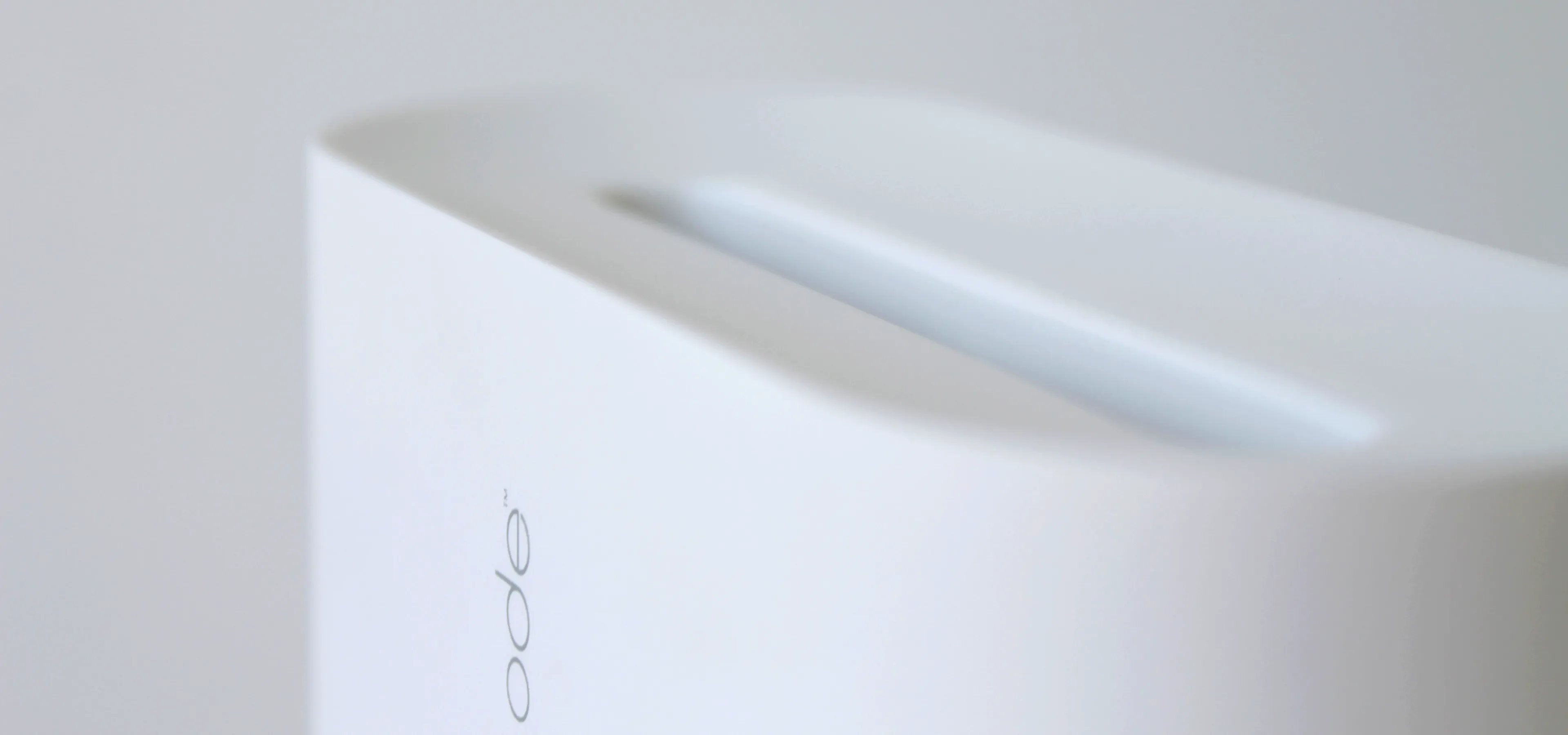 close up, minimal white image of an ode device