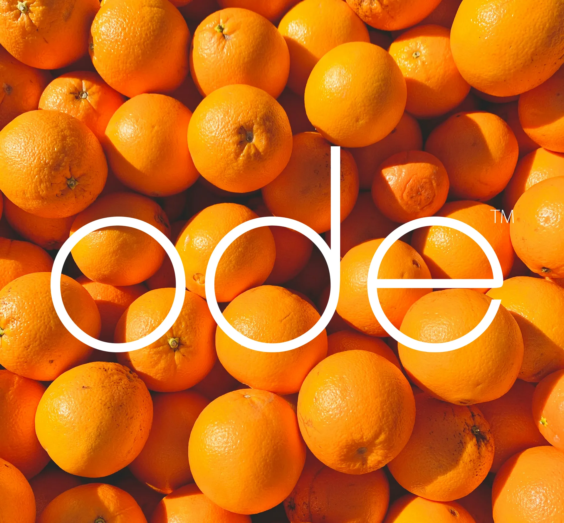imagine fresh juicy fresh oranges with a white crisp ode logo overlaid.