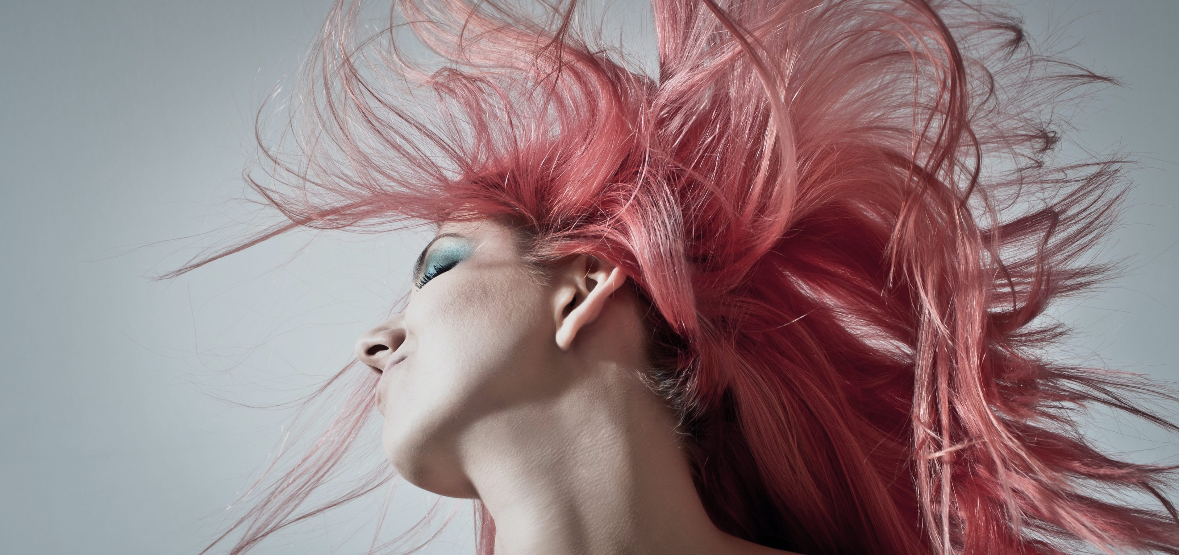 Woman with pink hair dancing
