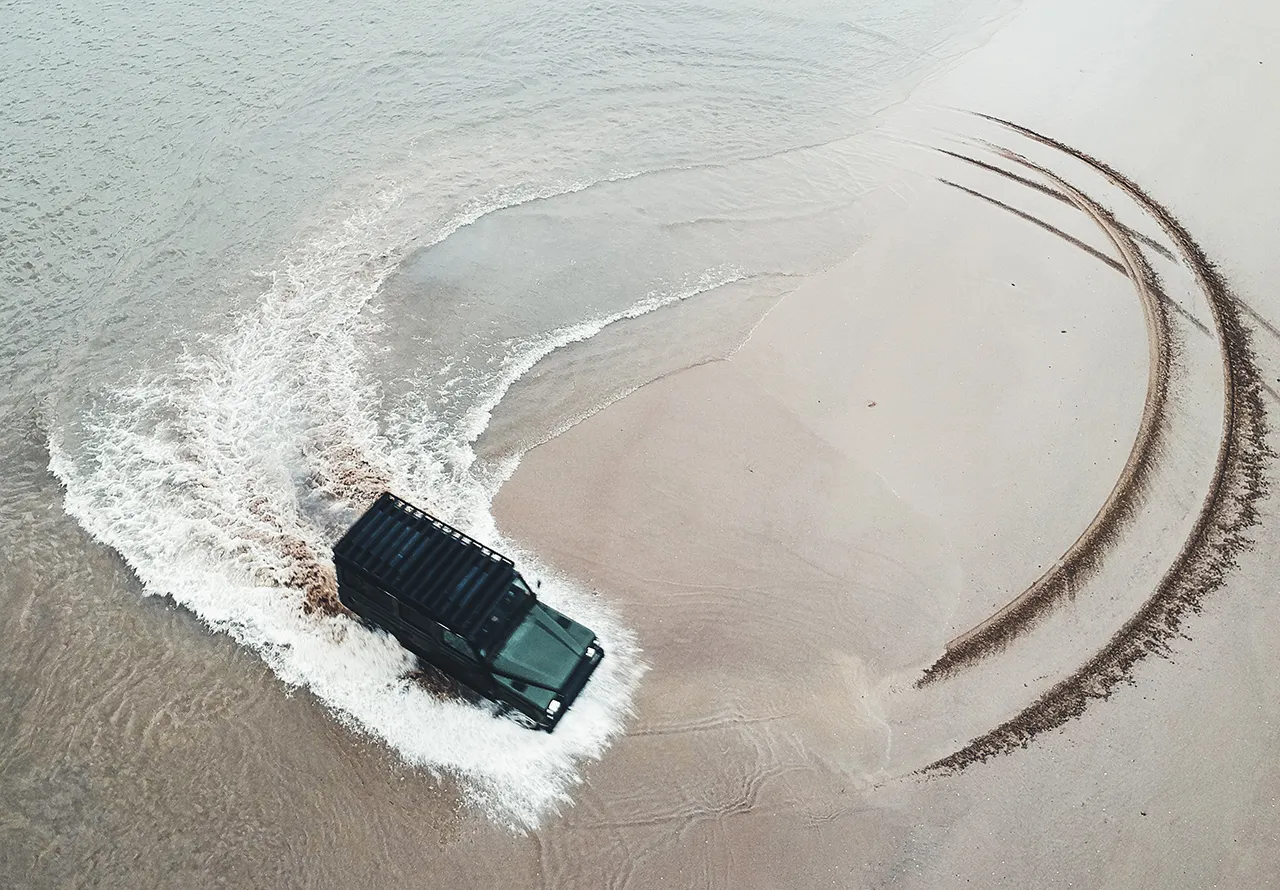 Land Rover on a beach featured by Rodd