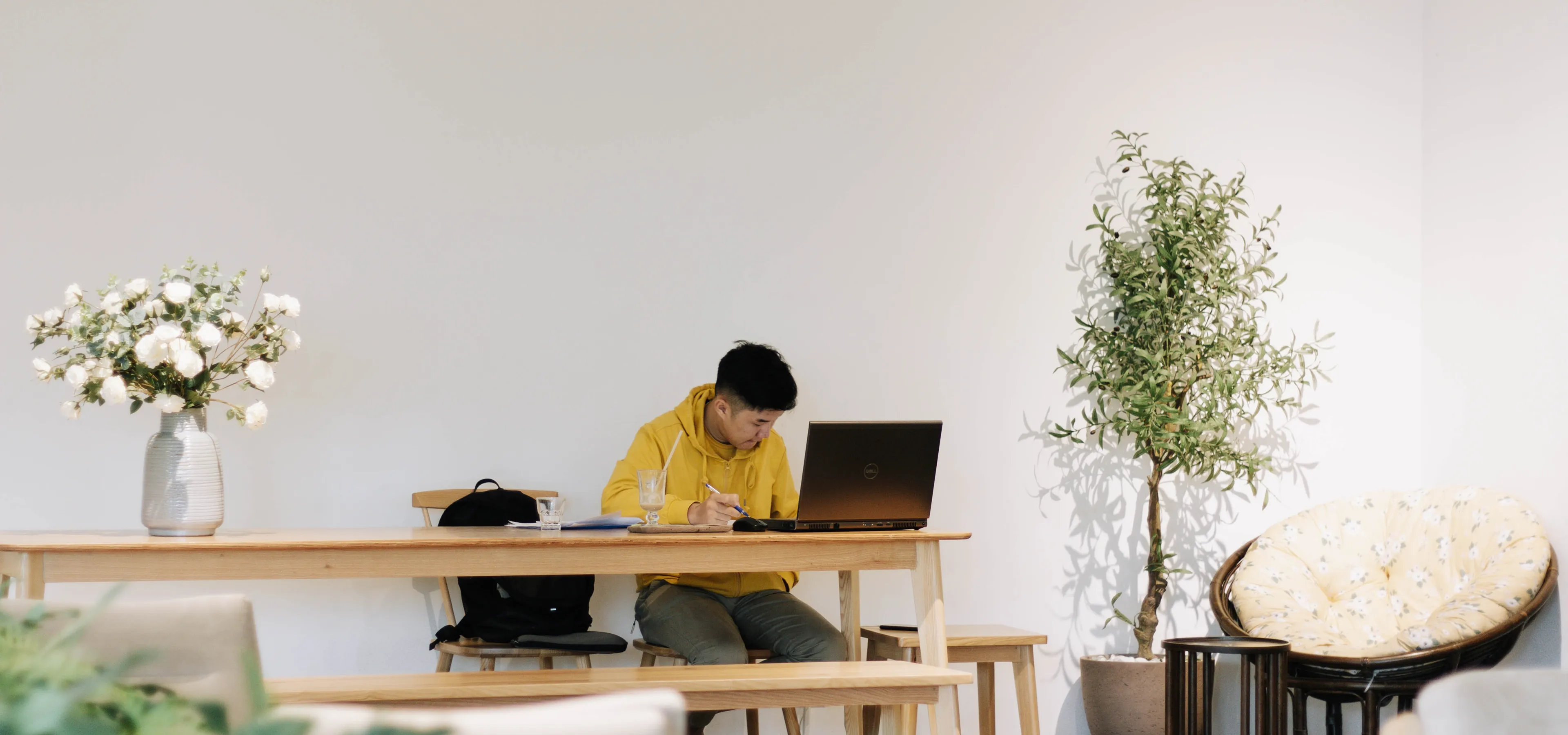 Man working at a laptop in a lifestyle environment