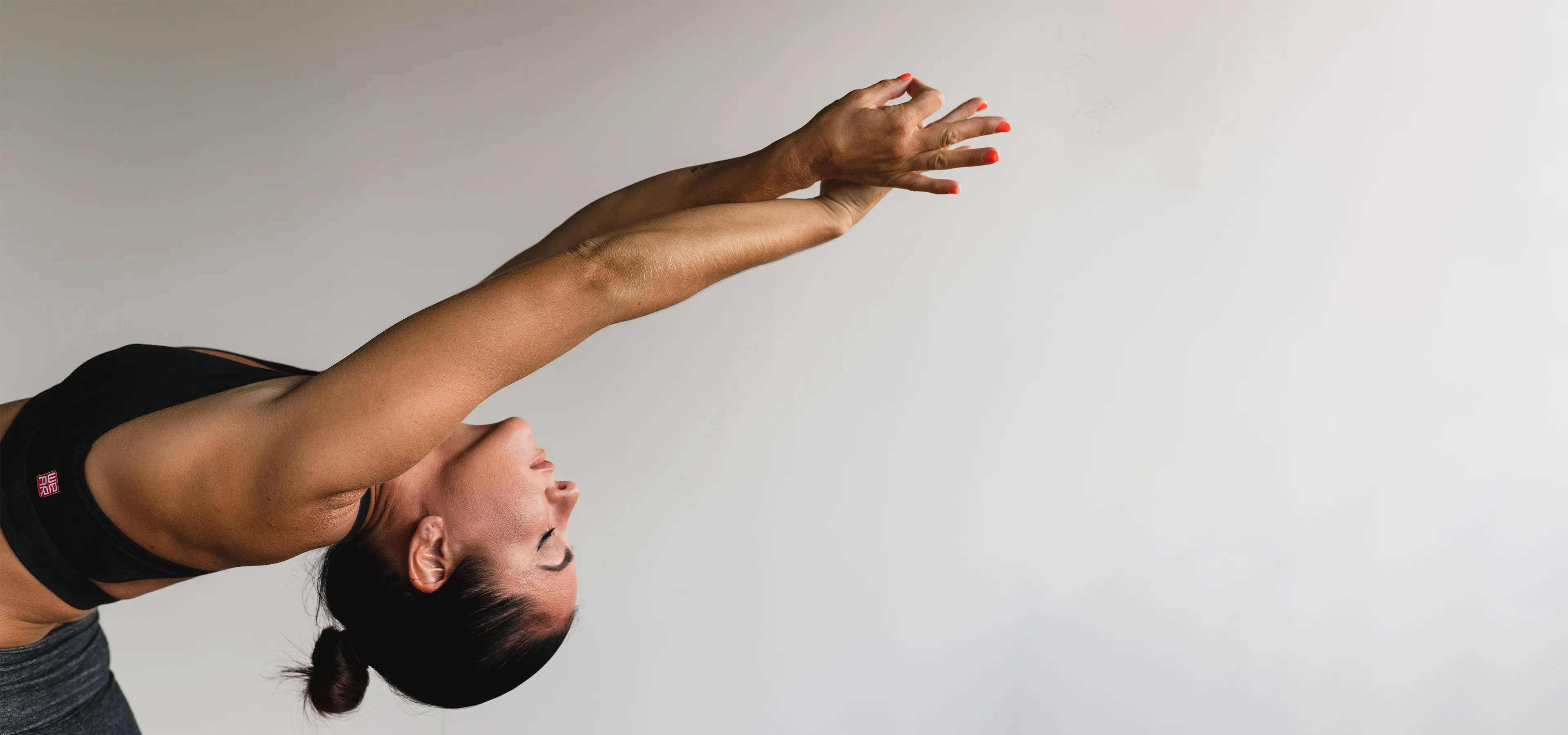 Woman reaching backwards during a yoga pose