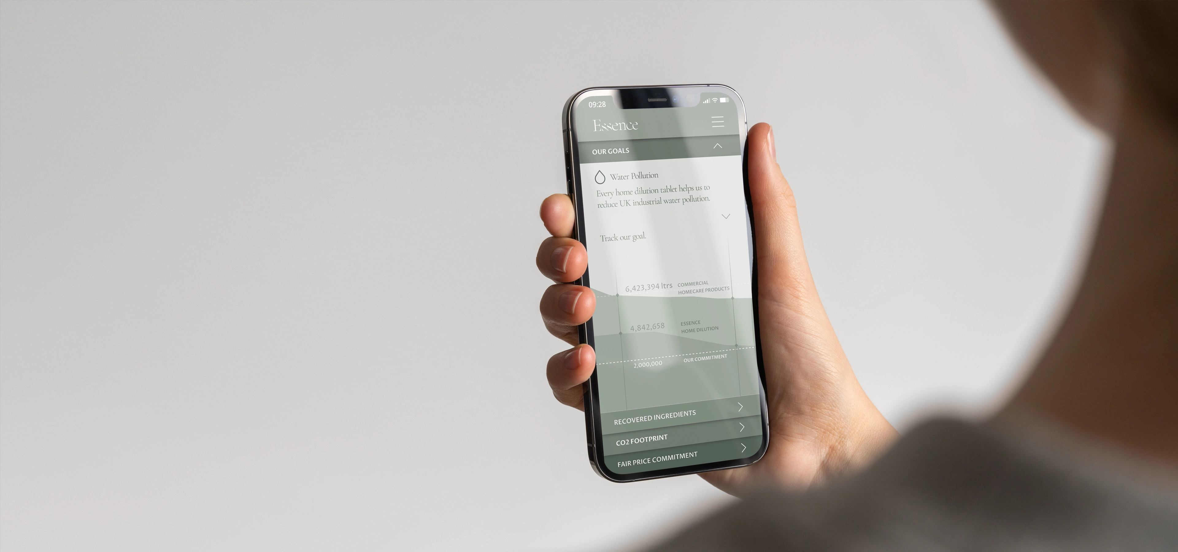 looking over someones shoulder at an iphone screen showing the essence app design by Rodd