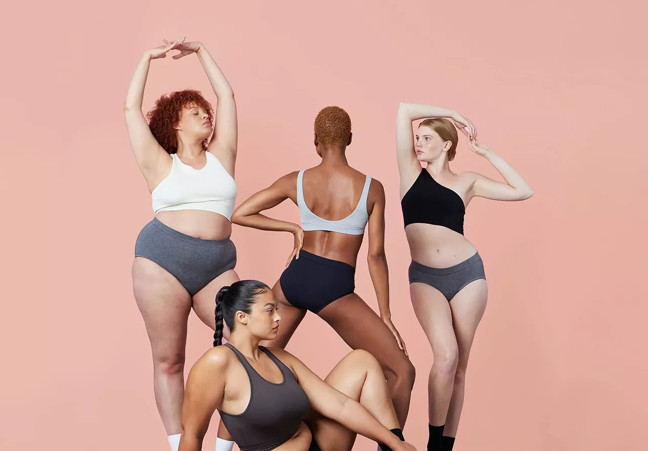 four female models in different poses from a Dove campaign