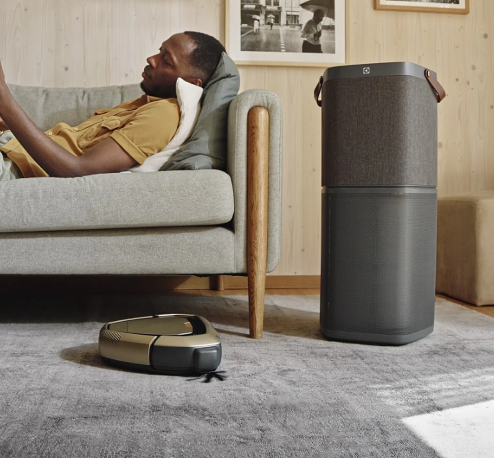 Man relaxing surrounded by Electrolux home appliances