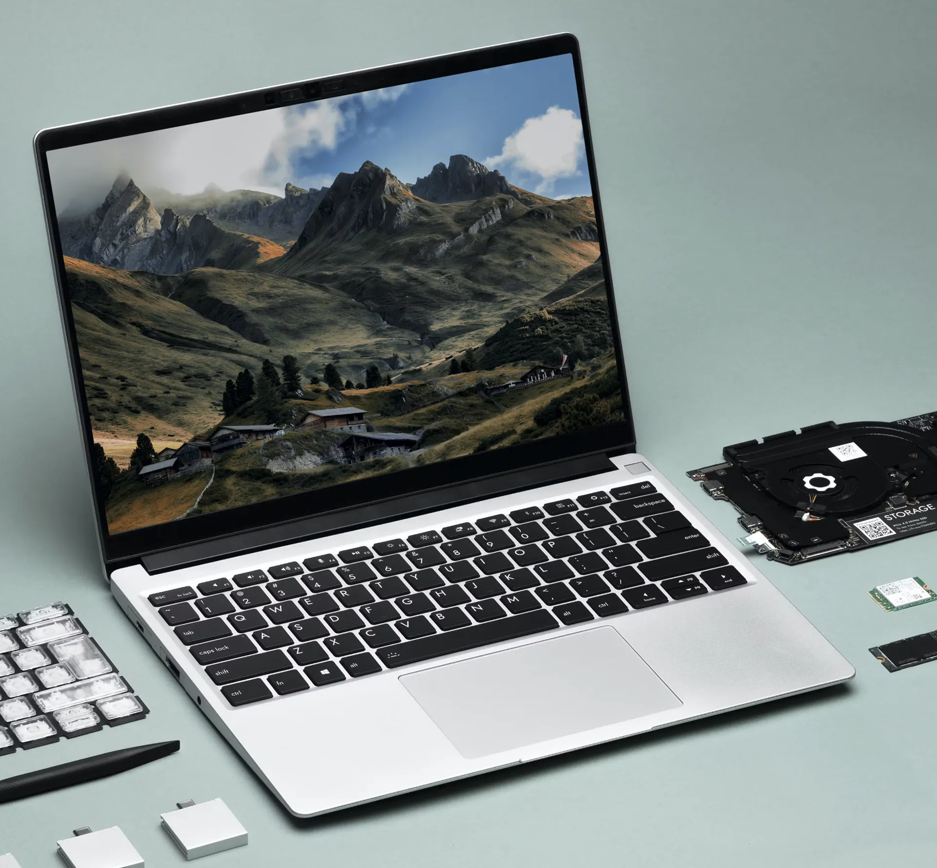 Image of the Framework repairable laptop surrounded by servicable and replacement parts