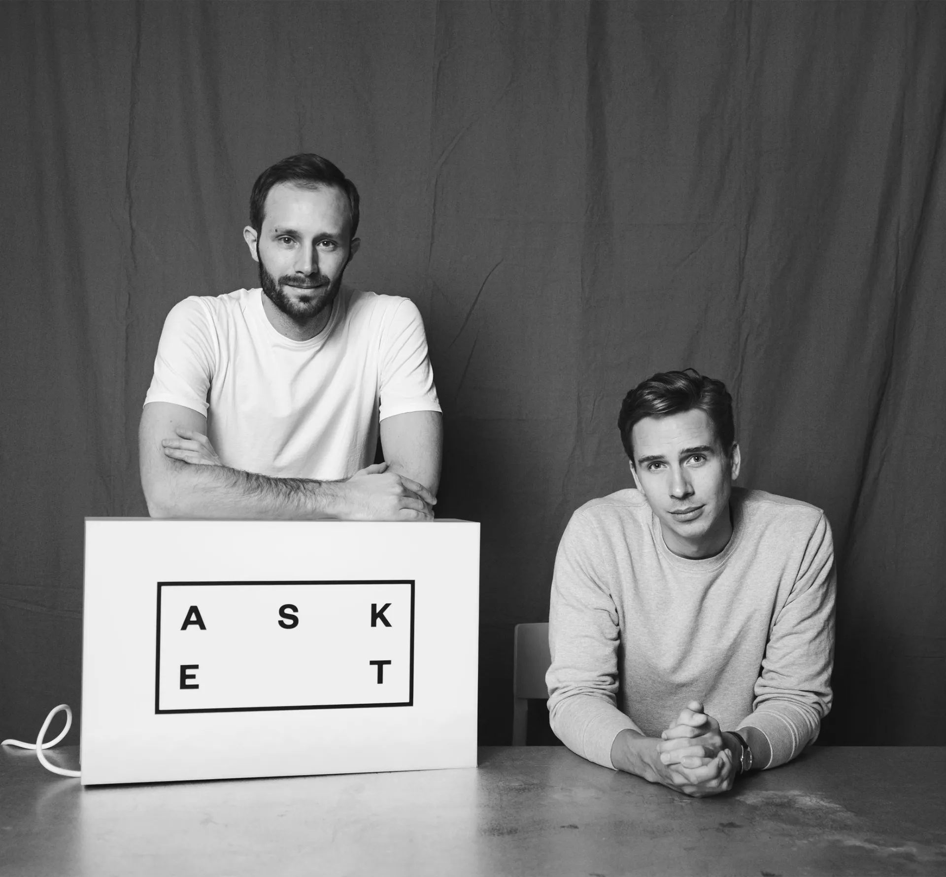black and white image of Asket founders facing the camera