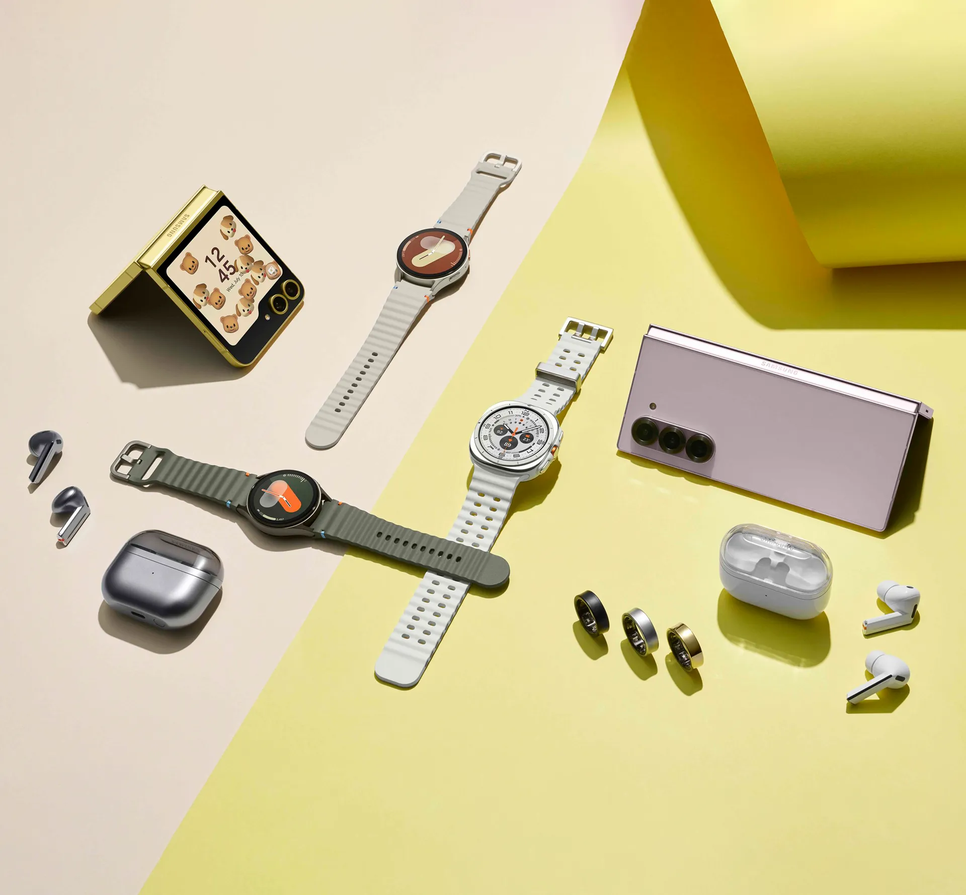 A selection of Samsung galaxy products on a pink and yellow background