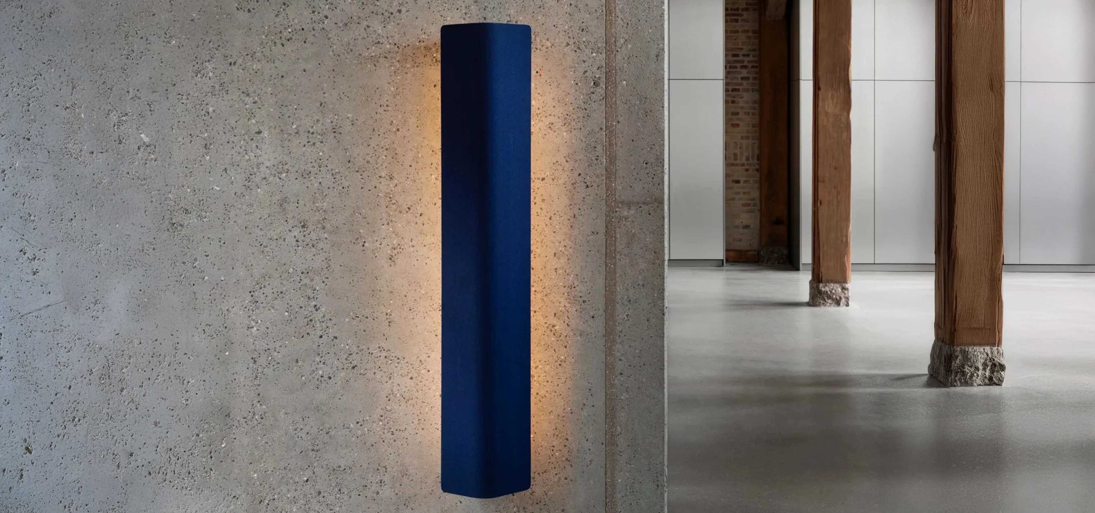 Light illuminating against a grey wall