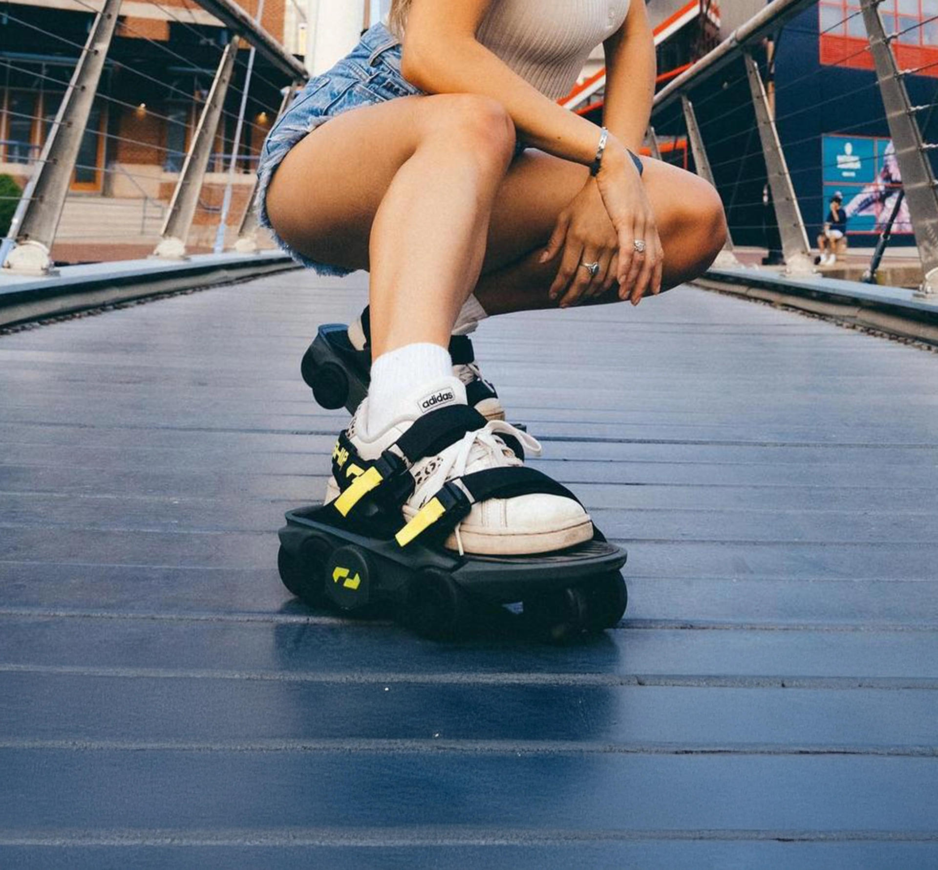 Woman in shorts showing off her wheeled shoes