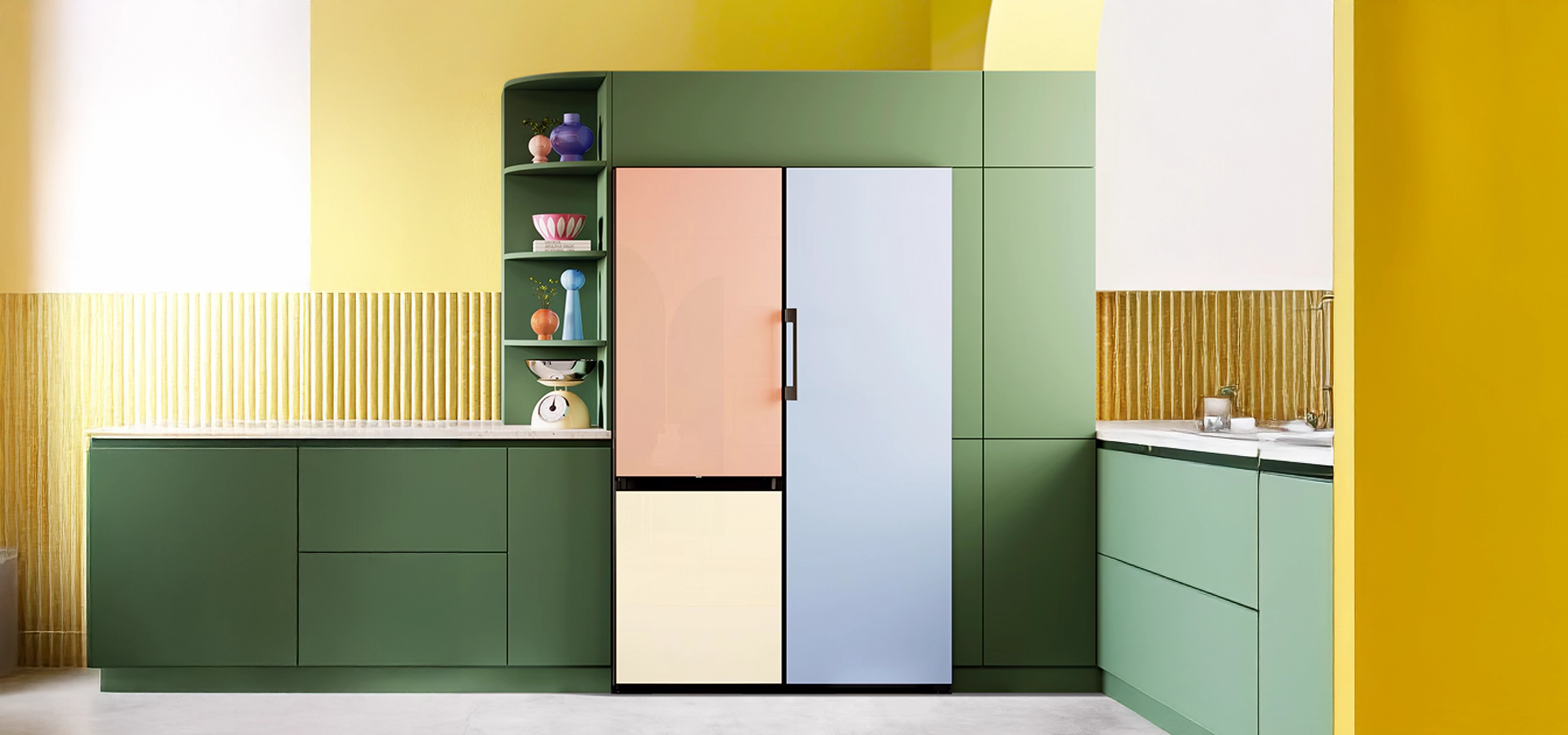 Kitchen with brightly coloured cabinets and built in appliances