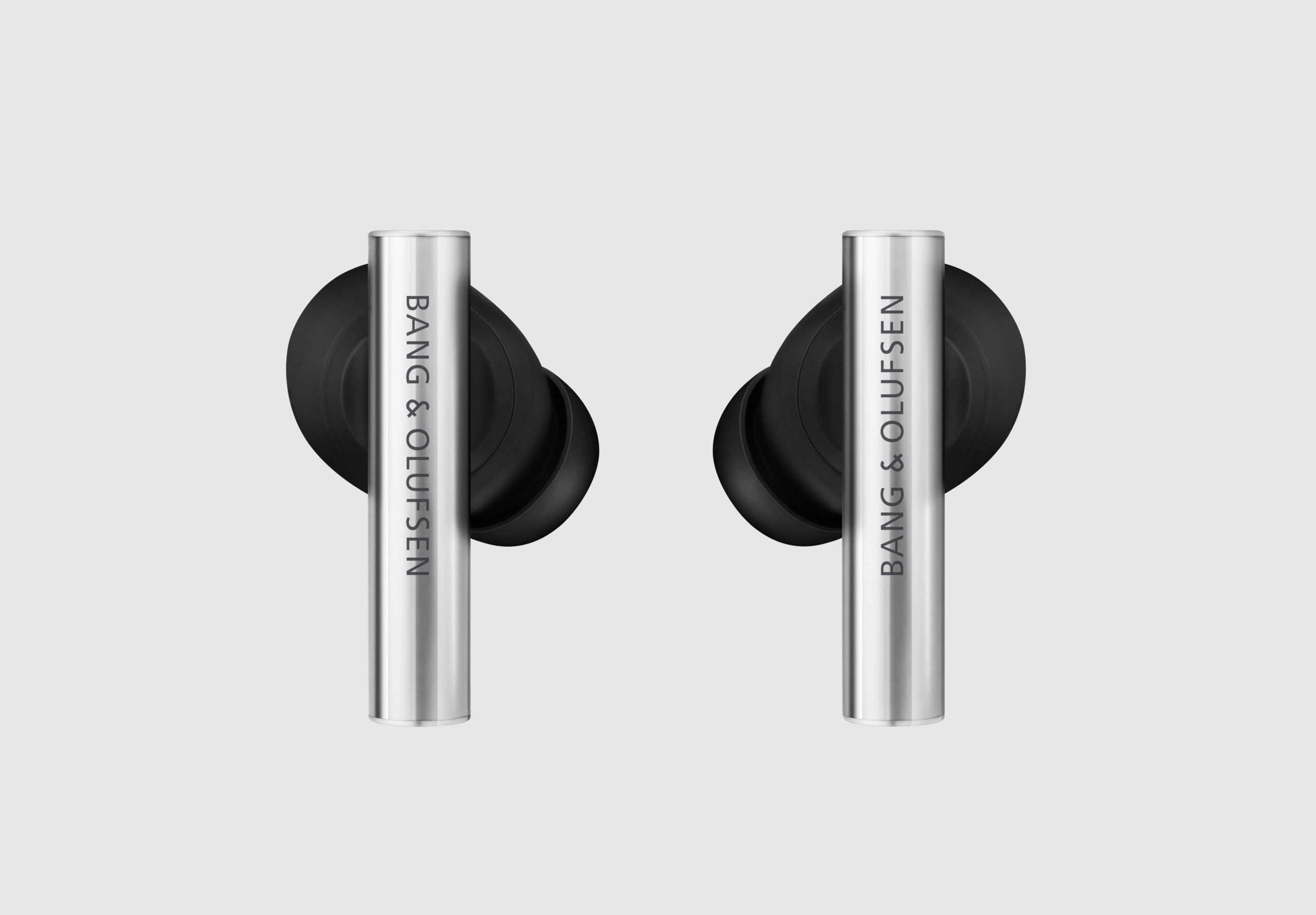 Silver and black B&O earphones