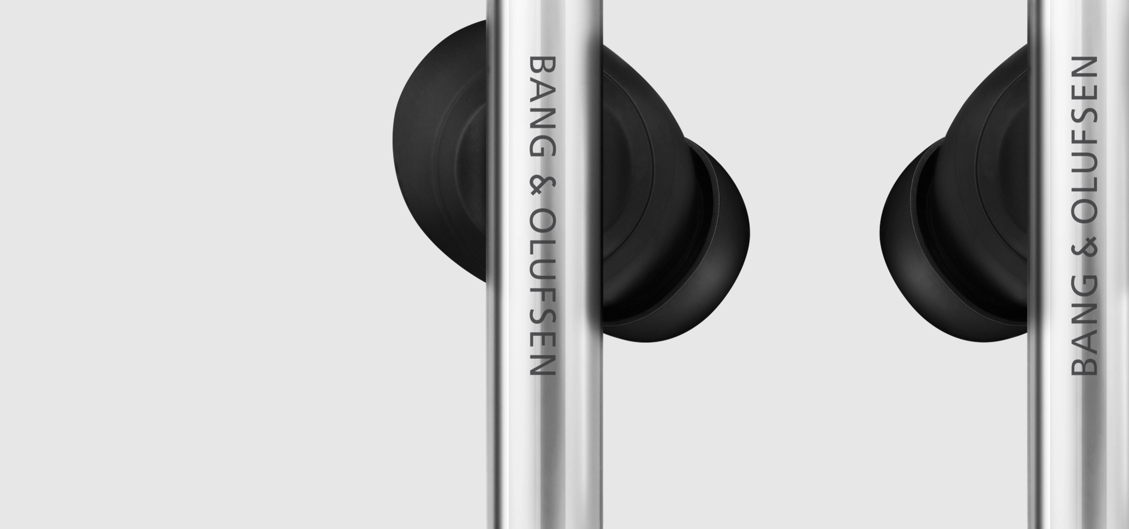 Silver and black B&O earphones