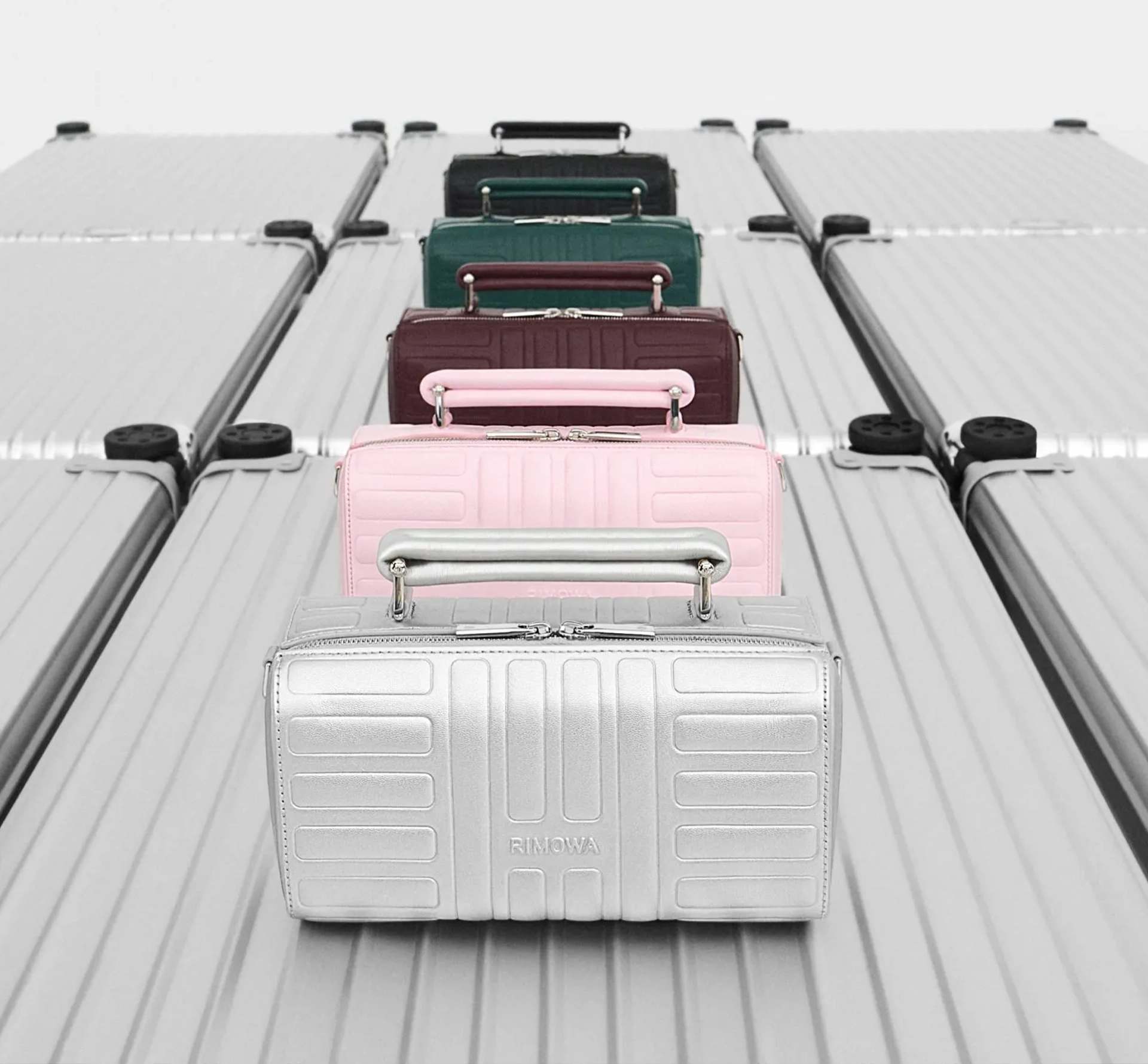 A collection of leather suitcases in different colours