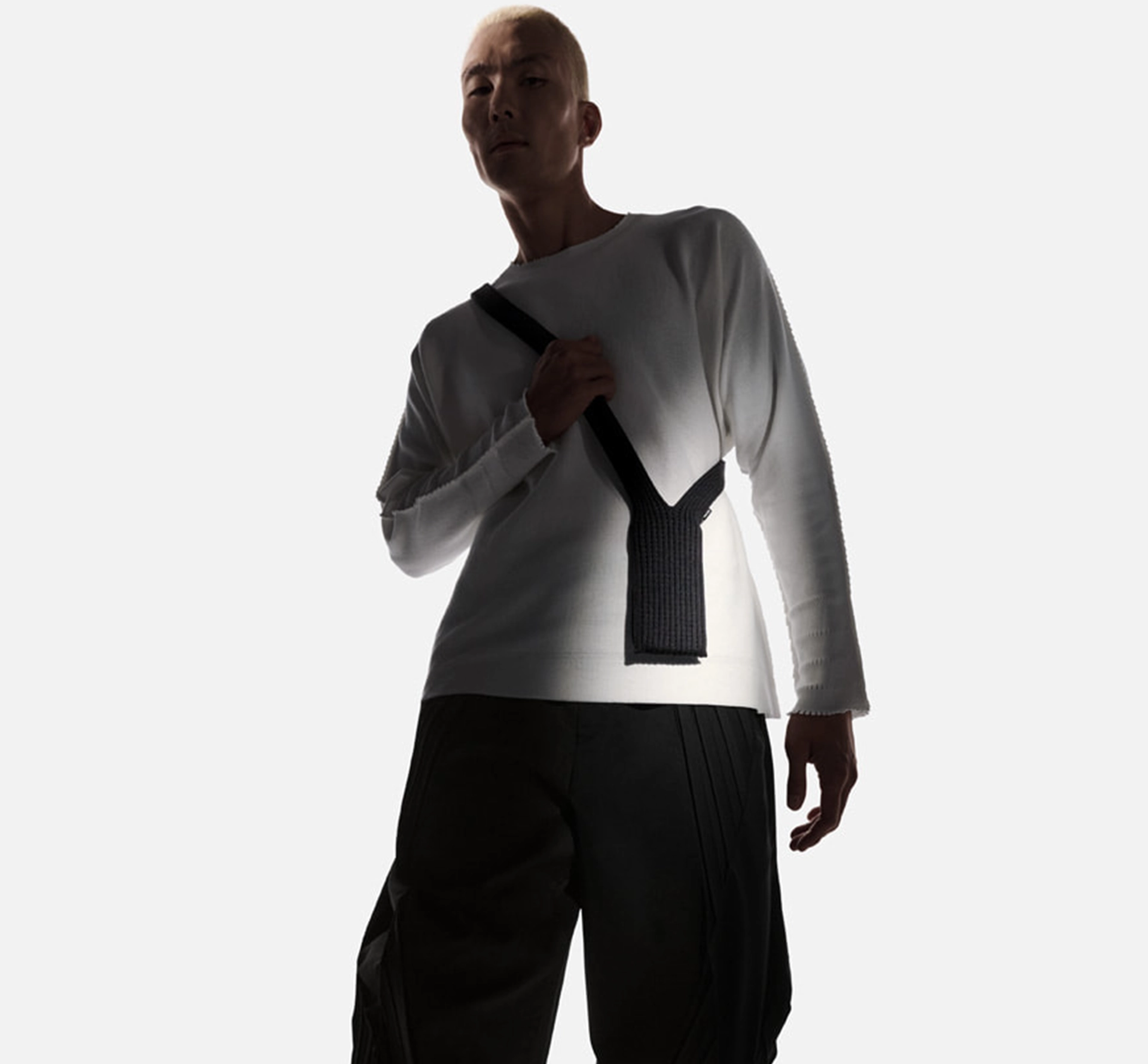 A person wearing an apple iphone knitted strap