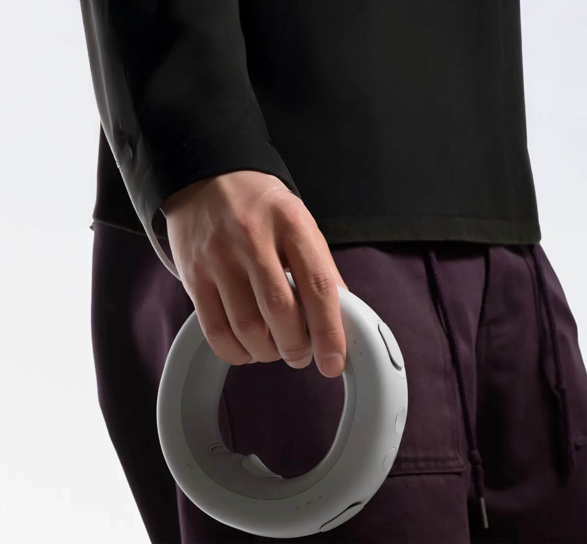 someone holding a ring shaped controller