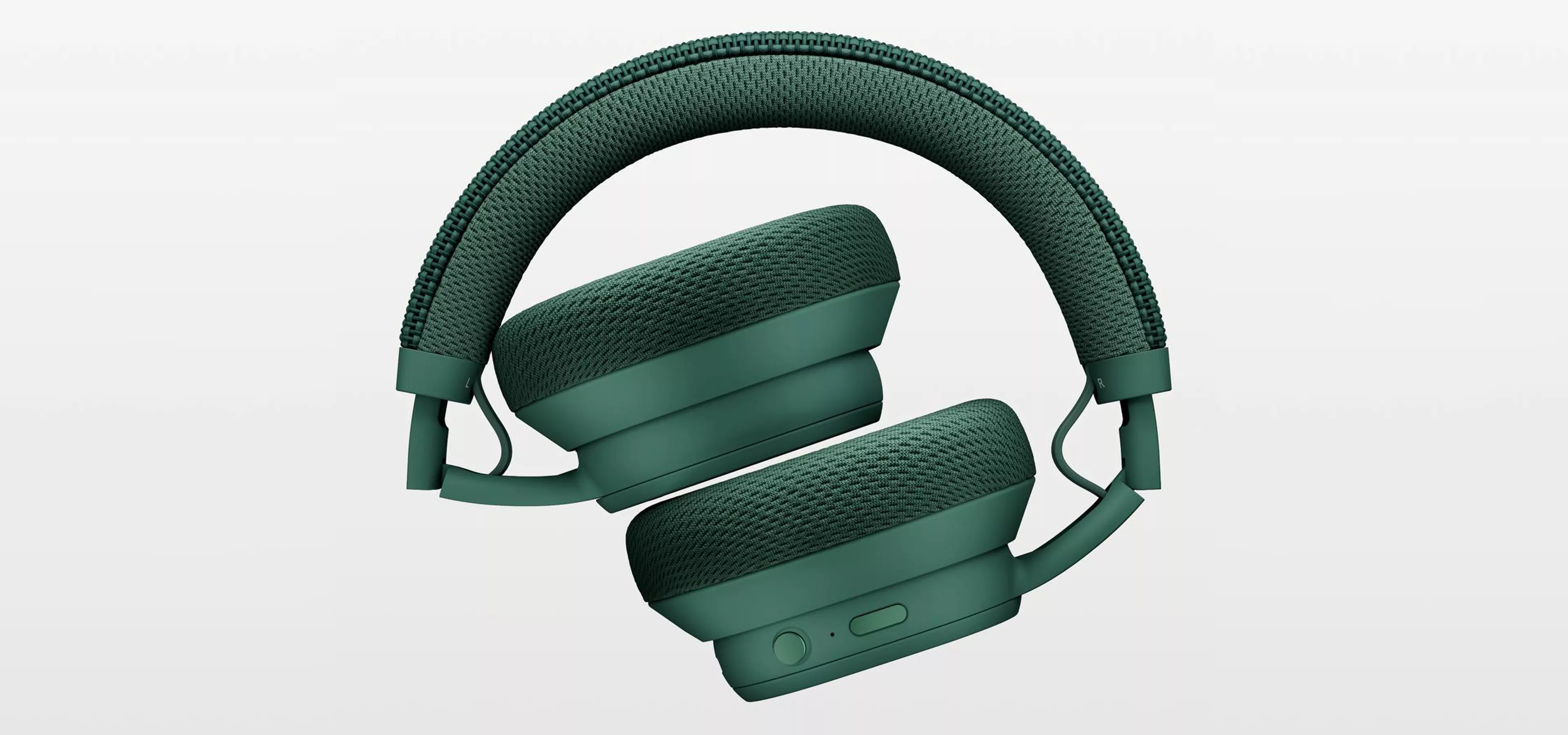 a pair of green fairphone overear headphones - demonstrating eco-design in consumer product design.