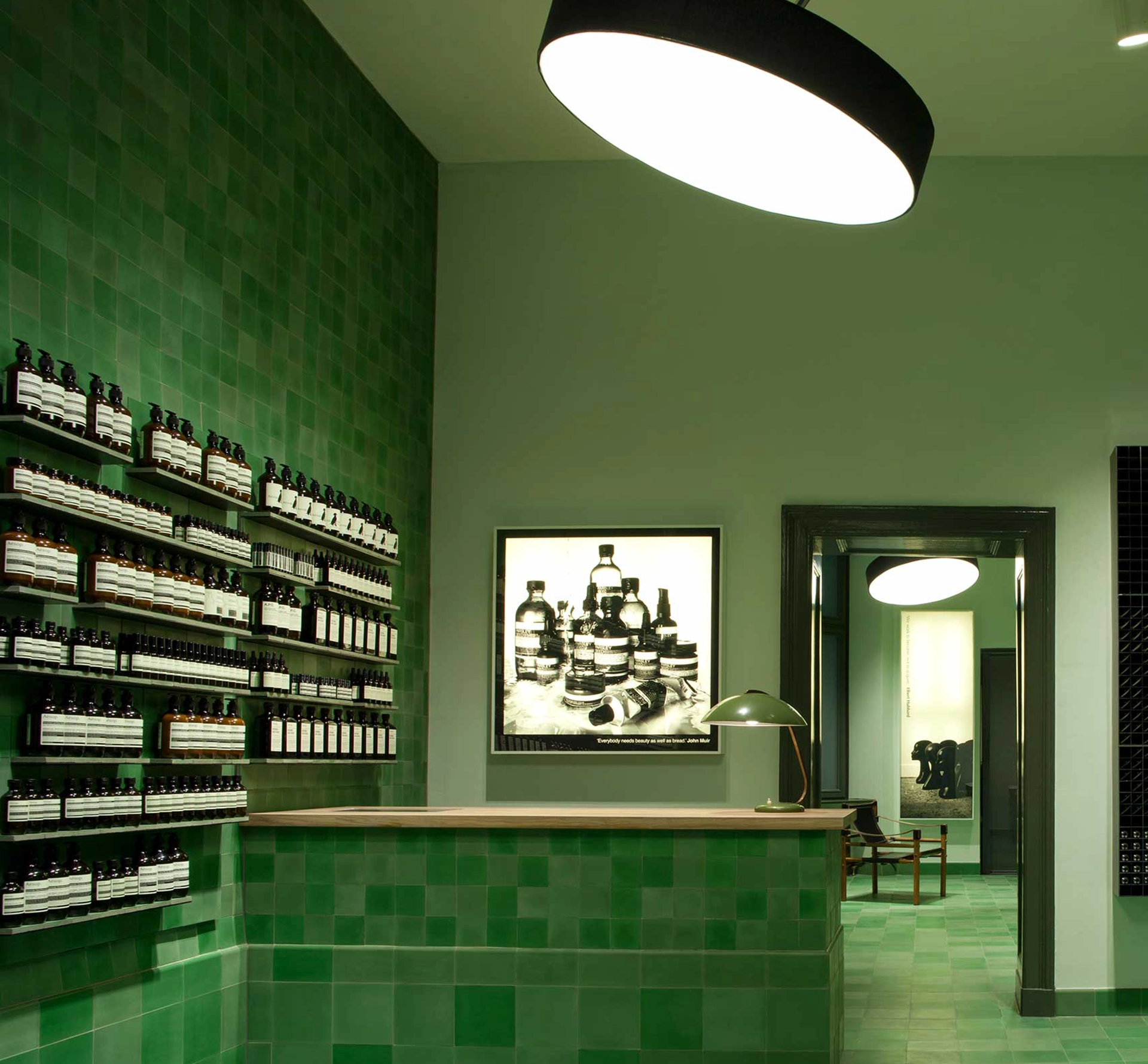 Inside an Aesop store in green colour
