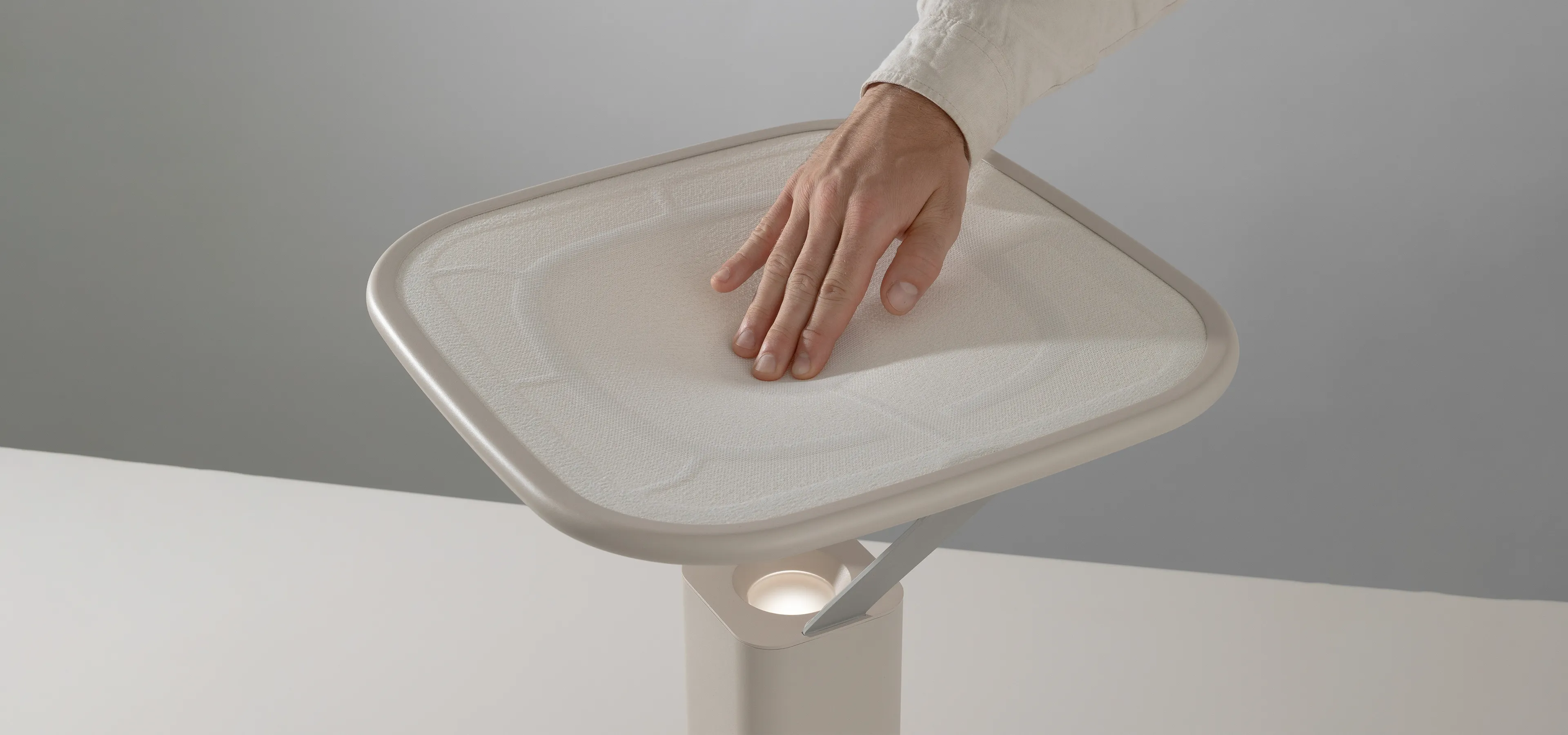 hand pressing on a fabric surface